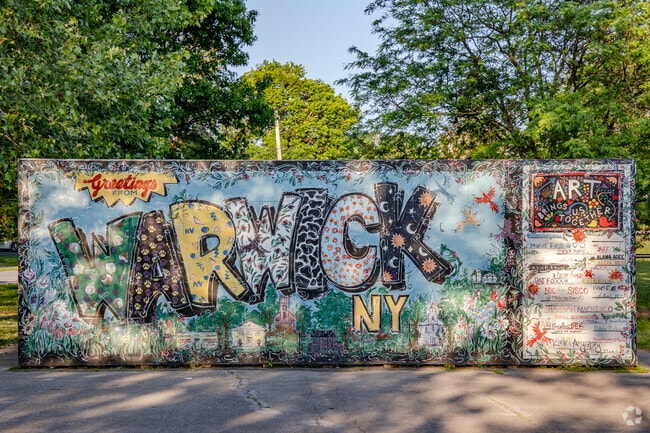 A colorful mural in Warwick, New York celebrates local pride and community creativity.