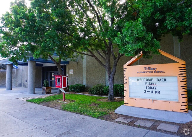 Burton C. Tiffany Elementary School sign and building in Eastlake shows the sign and library.