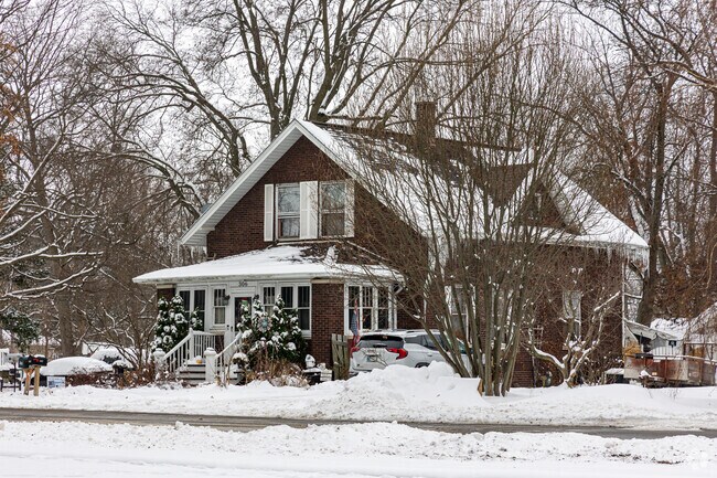 Century-old bungalow in Morocco features a steep gable roof and covered porch.