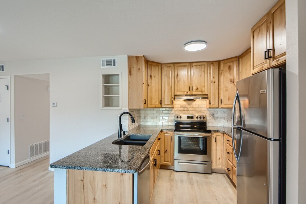 Tons of cabinet space, granite countertops & brand new stainless steel appliances