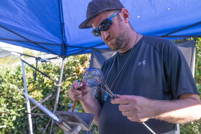 B-Money Glass creates a custom piece at the Gallery North Art Show & Music Festival in Setauket.