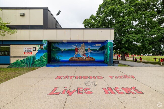 A colorful mural greets you as you you enter Raymond Elementary School in Brockton.