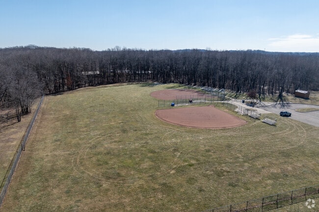 Discover the tranquility of Kreighbaum Park and enjoy a friendly game of baseball.