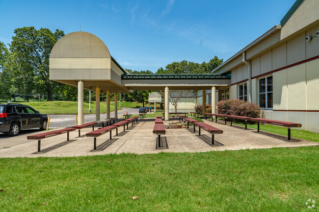 Shelby Oaks Elementary School has benches for students at the pick-up and drop-off area.