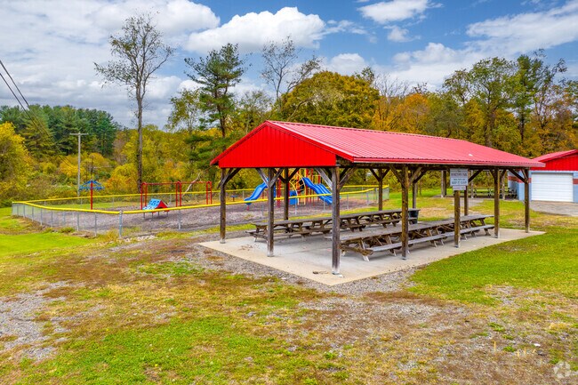 Relax under covered seating at Redstone Park near Luzerne Township.