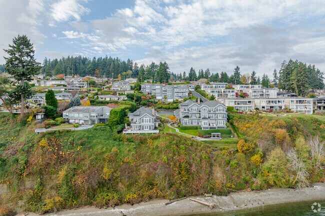 Large, luxurious homes sit beside the gated Dolphin Reach condo community in Shore Acres.