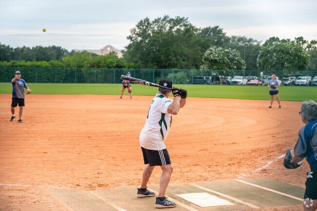 Village of Belvedere residents enjoy the action of local softball tournaments.