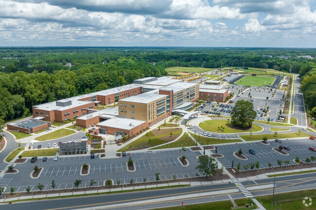 Fuquay-Varina High School in Fuquay-Varina is bordered by densely packed trees.