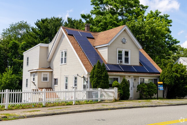 A unique single family home with solar panels in the Pleasant Hills neighborhood of Saugus, MA.