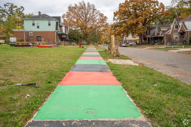 A painted sidewalk brings color to the Littlefield Community.