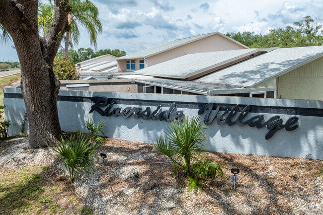 Mature trees and larger yard spaces make up the neighborhood of Riverside Village.
