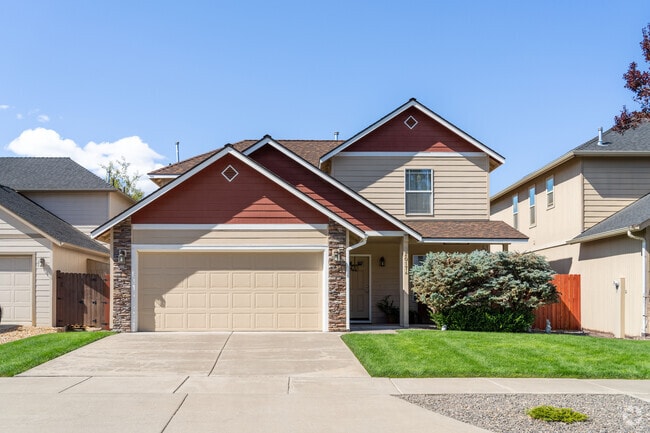 Homes in Southeast Bend, featuring a cozy porch, colorful landscaping, and modern touches