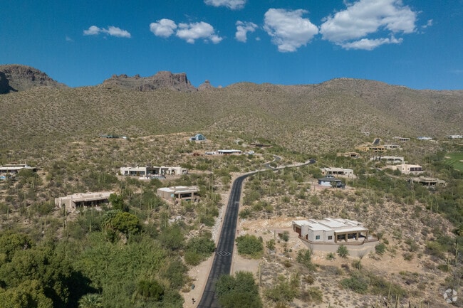 An elevated look at the curvy roads going up to the mountains.