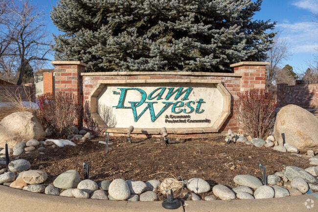 An entrance sign marks the Dam West Covenant Protected Community in Aurora, Colorado.