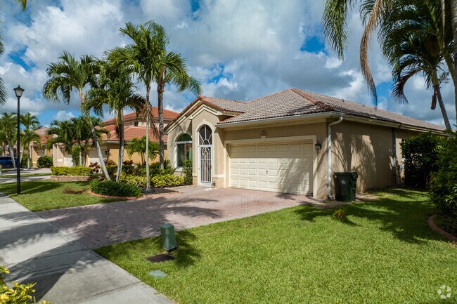 Mediterranean Revival homes come with arched entries in Banyan Trails.