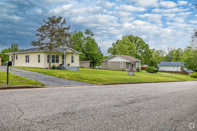 Homes in Stapleton sit on larger lots surrounded by trees.