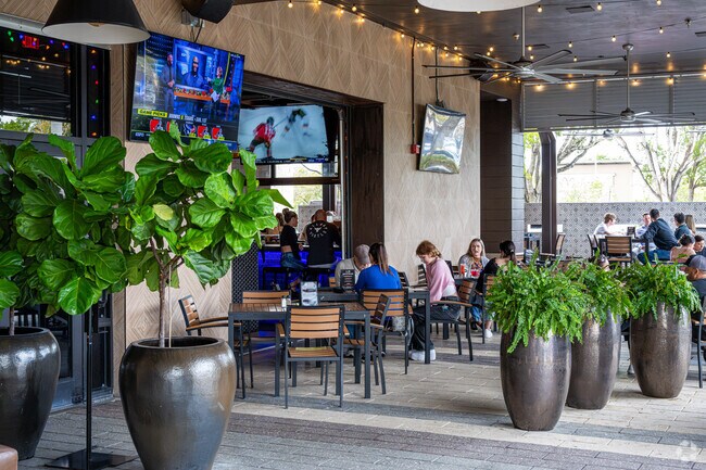 Tap42 is a popular sports bar in Fern Crest Village with a lively atmosphere.