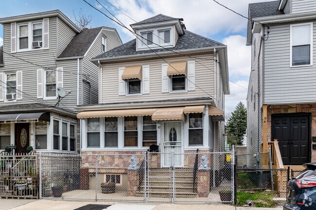 Upper Vailsburg has many single-family homes with porches and small fenced front yards.