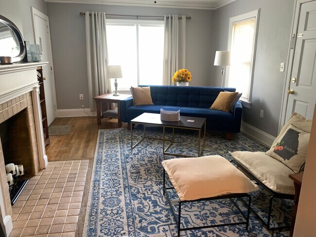 living room: smart TV, AC/heat, door to private porch