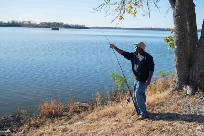 A man enjoys a quiet day of fishing at Horseshoe Lake State Park.