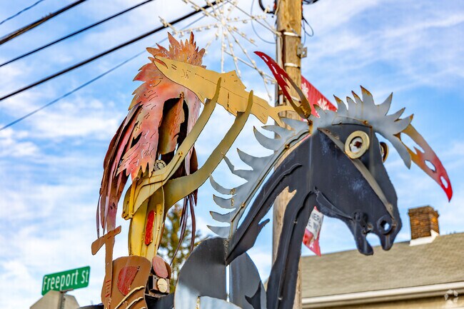 A metal statue stands outside of the Salem Antiques store in Delmont.