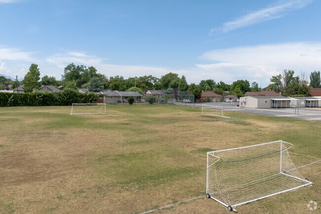 Soccer fields at Highland Park Elementary School under a blue sky.