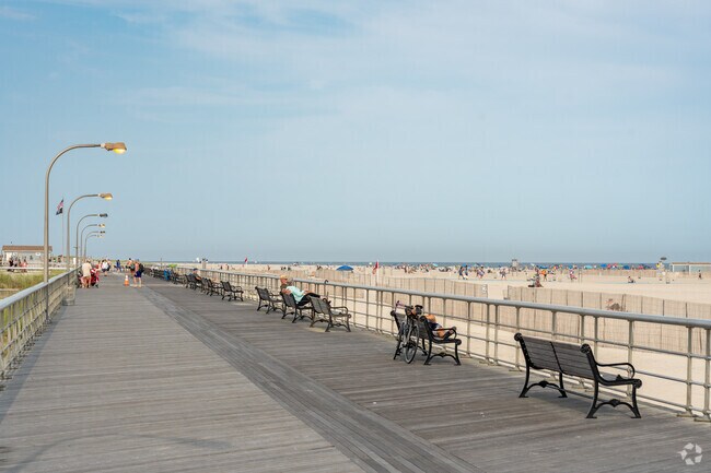 Enjoy the relaxing sunset with your family on the Jones Beach boardwalk.