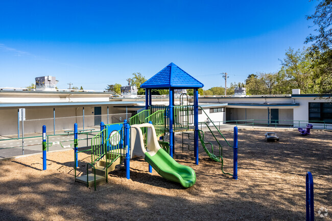 Children use the playground at recess at Highland Elementary.