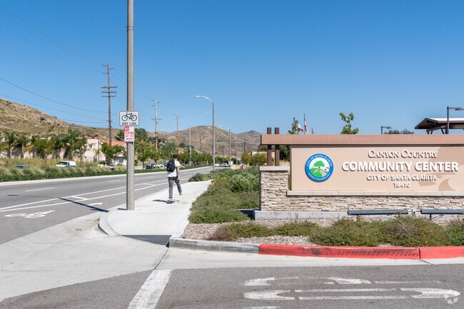A person skateboards down the street in Canyon Country.