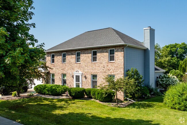 Located in Lumber River is brick Colonial Revival home style with a minimal landscaping.