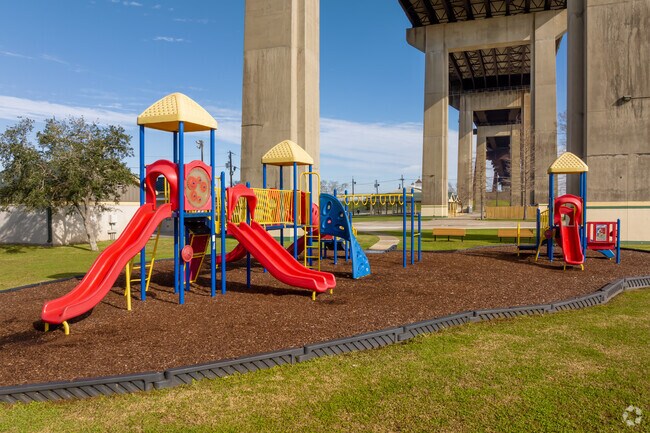 Kids enjoy playing on the playground at the West Bank Bridge Park.