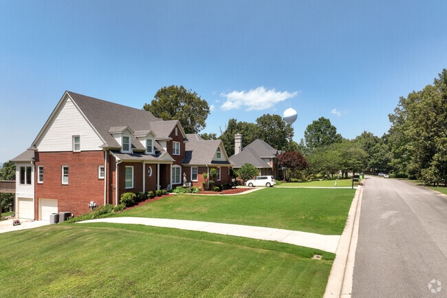 Larger brick homes with large lawns can be found in Leeds.