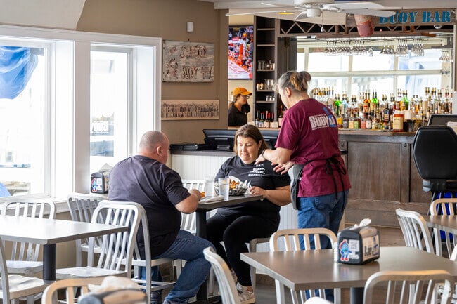 Chic's Beach locals enjoy fresh seafood and delicious drinks at Buoy 44 Seafood Grill.