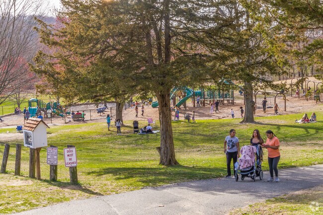 Parents and their kids enjoy the safe and peaceful Meckauer Park in Bethel.