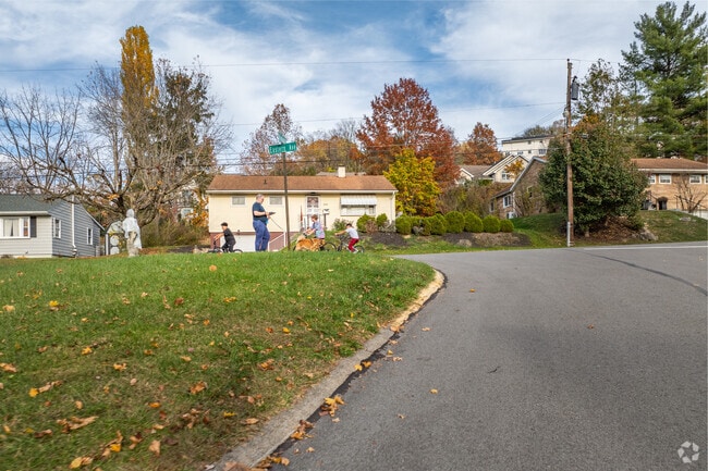 Children ride their bikes and people take walks in the Suncrest neighborhood.