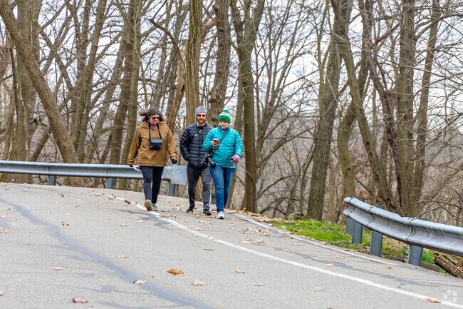 Perry North residents enjoy a stroll in Riverview Park.