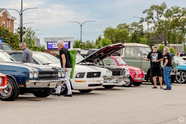 Visitors admire classic cars at the Rock 'N Wheels in Addison.