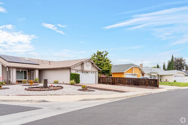 A serene row of ranch homes in Hendrick Ranch, where rustic charm meets modern comfort, creates a peaceful retreat in the heart of Moreno Valley.