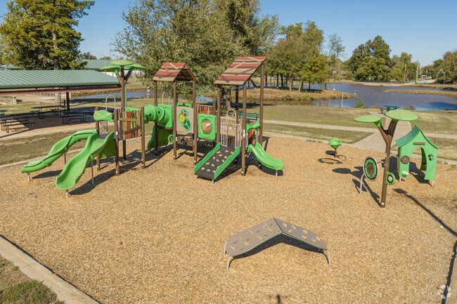 Play around on the Legion Park playground next to Legion Park pond.