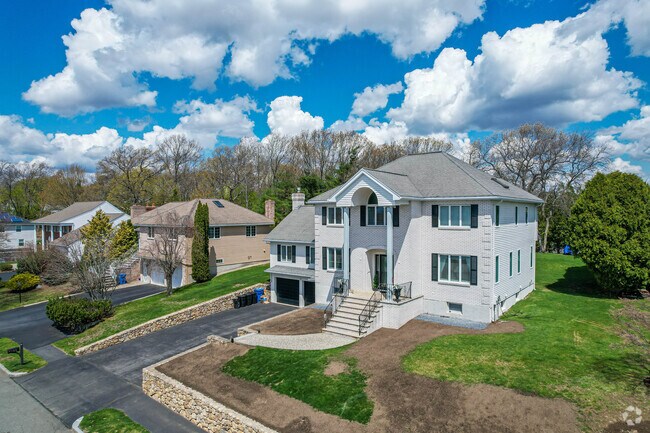 Homes in North Waltham include large brick colonial homes.