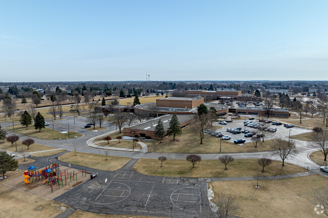A playground and sports courts are shared between Lenawee Christian School and Centre Park.
