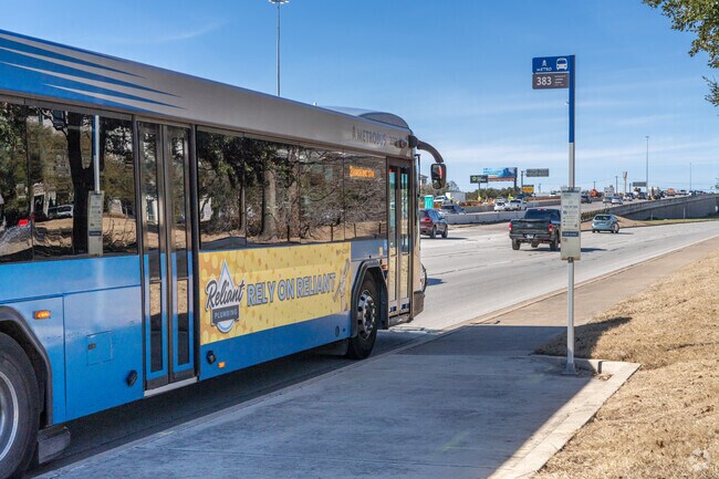 Several bus stops can be found along Research Boulevard.