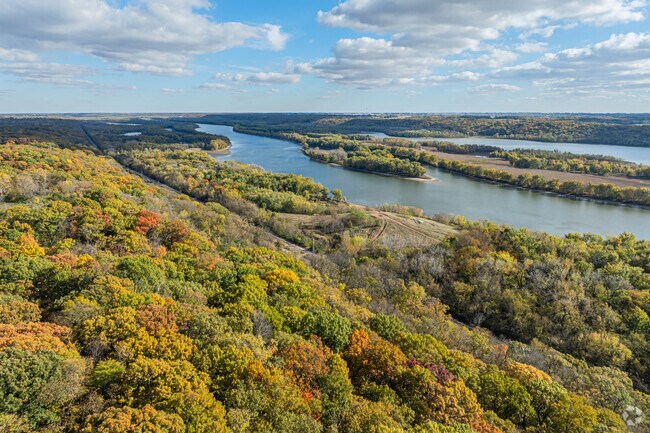 A quiet country road winds through Spring Valley’s autumn-kissed farmland.