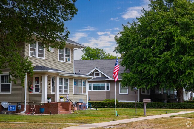 Neighborhood housing in Aurora includes older styles with tree-lined sidewalks.