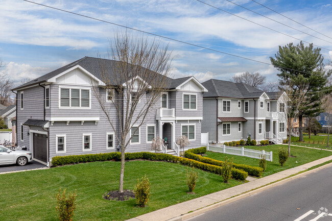 A row of spacious, new homes gracing the streets of Oakhurst, NJ.