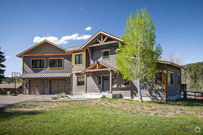 A contemporary craftsman mountain home sits high on the mountains in Indian Hills.