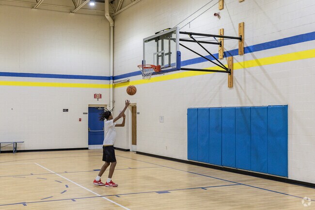 Huntersville Community Center has indoor basketball courts for residents.