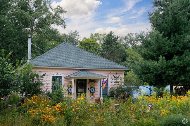 A pink house with a beautiful garden brightens Marine’s scenic streets.