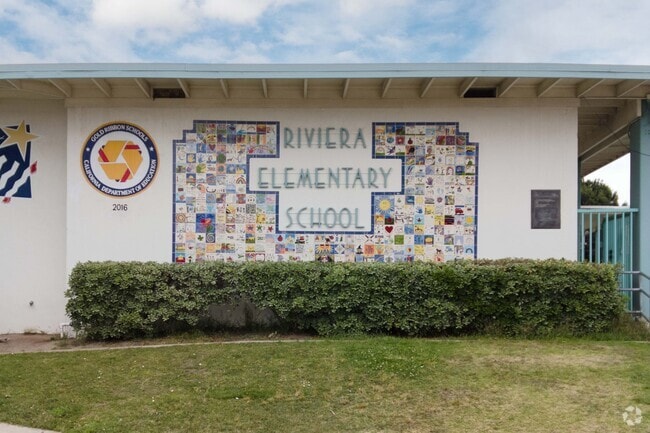 Children's art is emblazoned on the wall at Riviera Elementary School in Riviera.