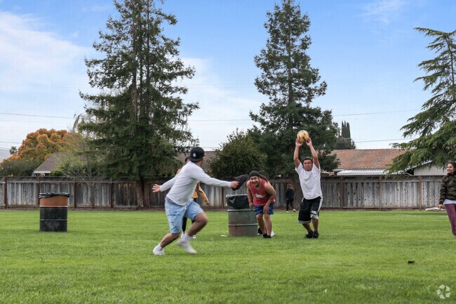 Friends gather for a game of soccer, bringing May Nissen Park in Livermore to life.